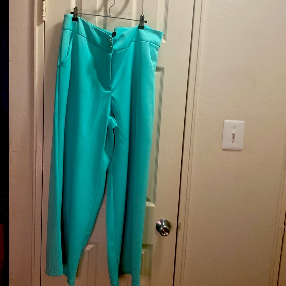 Ashley Stewart turquoise polyester and spandex wide leg pants.